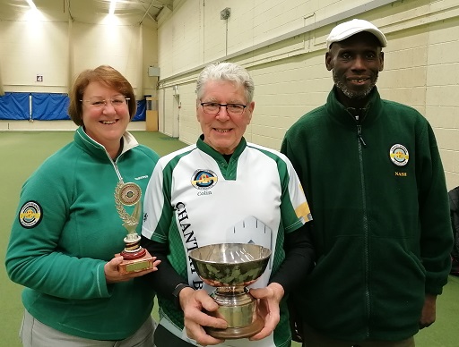 Joanne Colin and Nash stand smiling with their trophies.